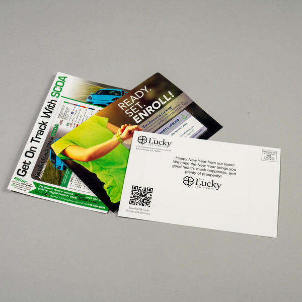 Magnetic mailer postcards by Magnetic Attractions in multiple sizes and designs, each with a removable fridge magnet.